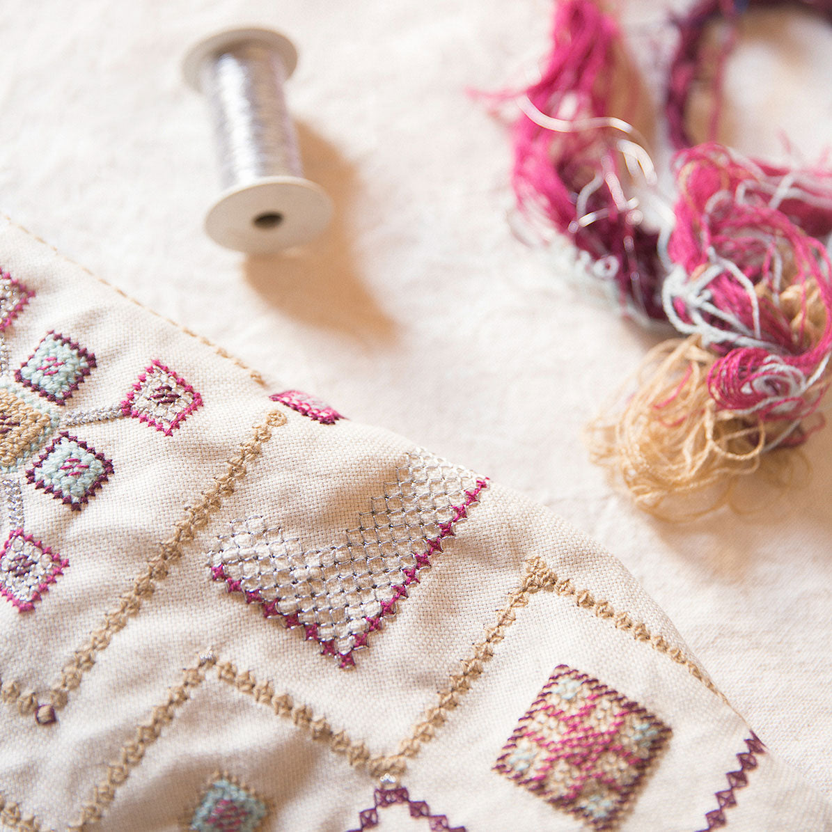 Laneh Gouder cushion with embroidery yarn