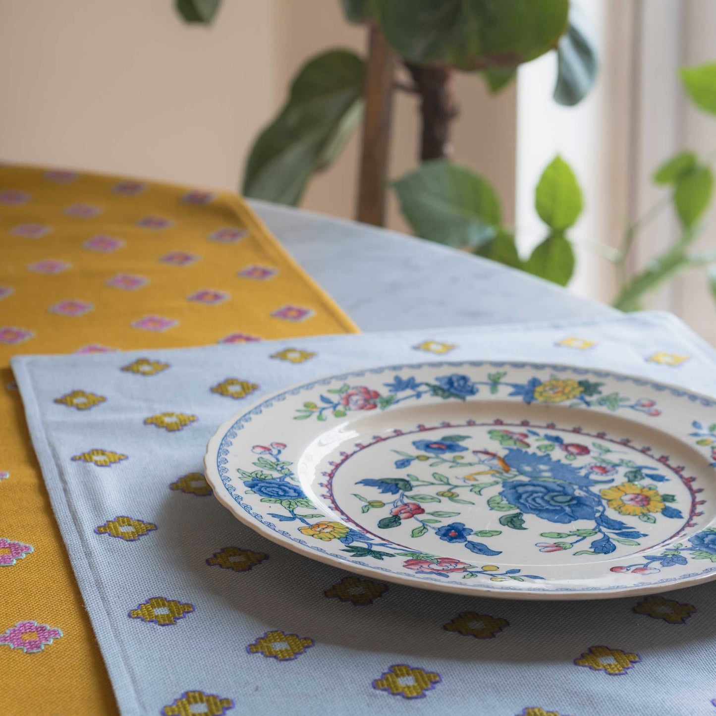 placemat and mustard runner on a table