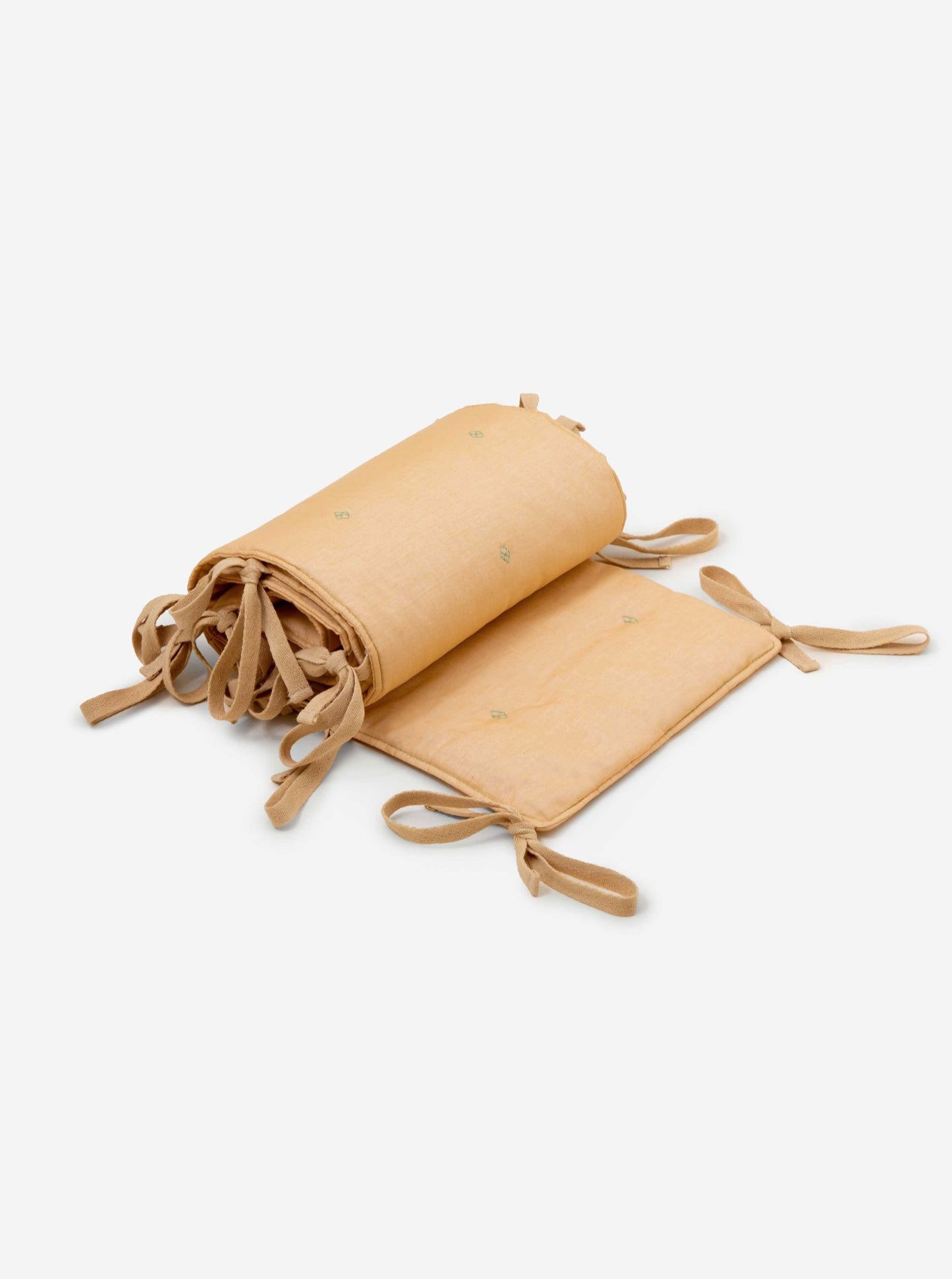 Wheat bandook crib bumper with blue green embroidery