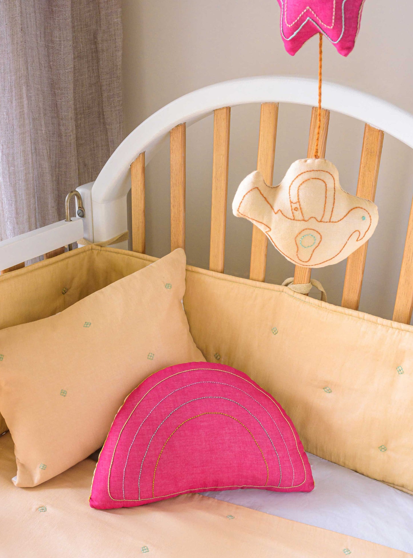 Wheat Bandook pillowcase, bumper, blanket and mobile with Fuschia rainbow cushion