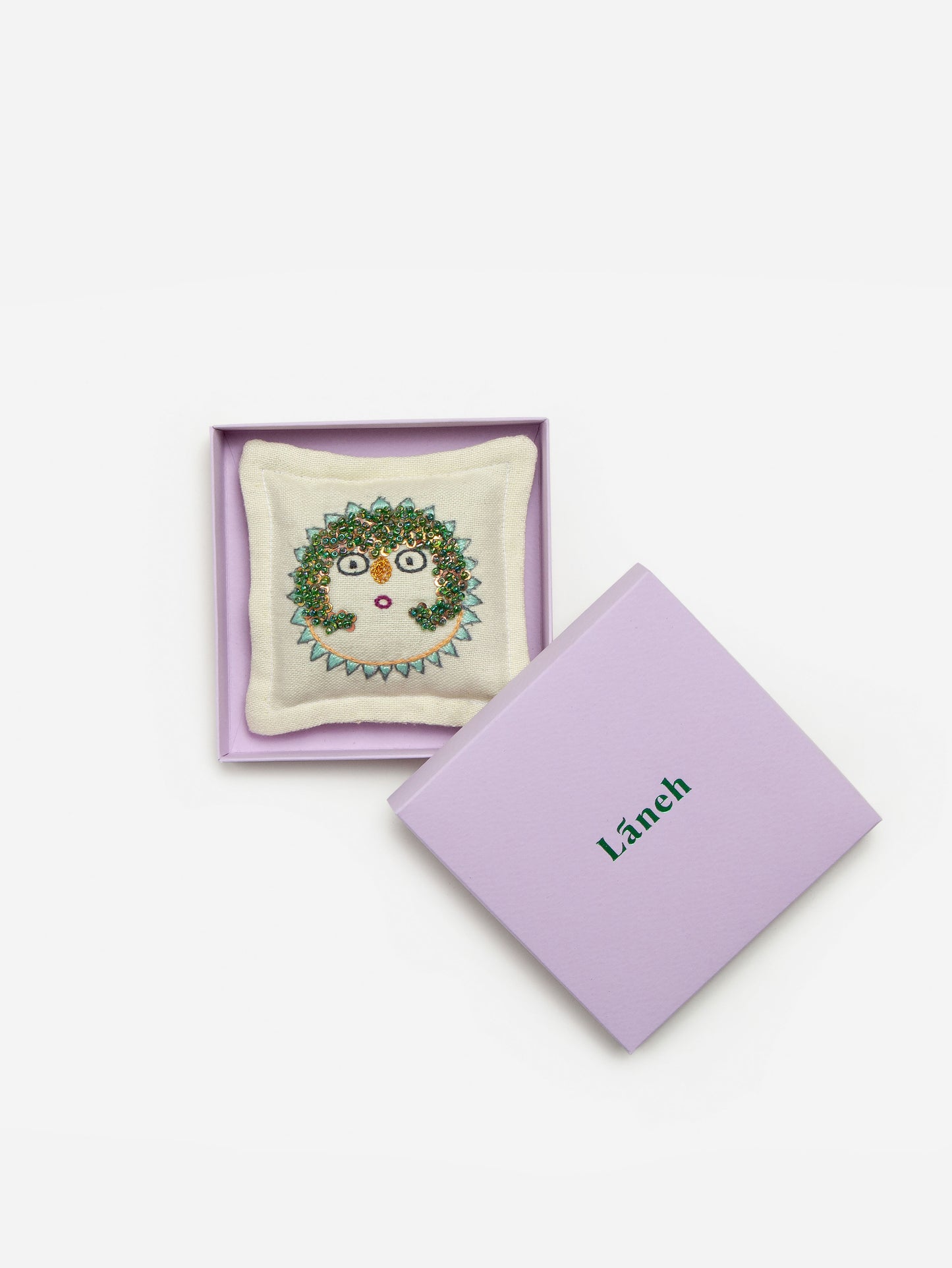 Yellow / Parrot green embroidered Sun Lady Lavandin sachet with green beads placed inside a lavender Laneh box
