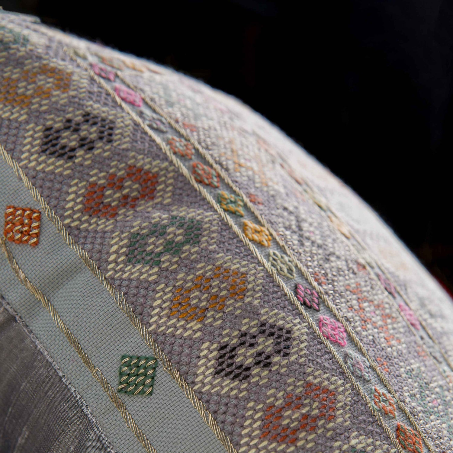 Close up photo of Midnight blue Zee cushion with intense Baluchi embroidery