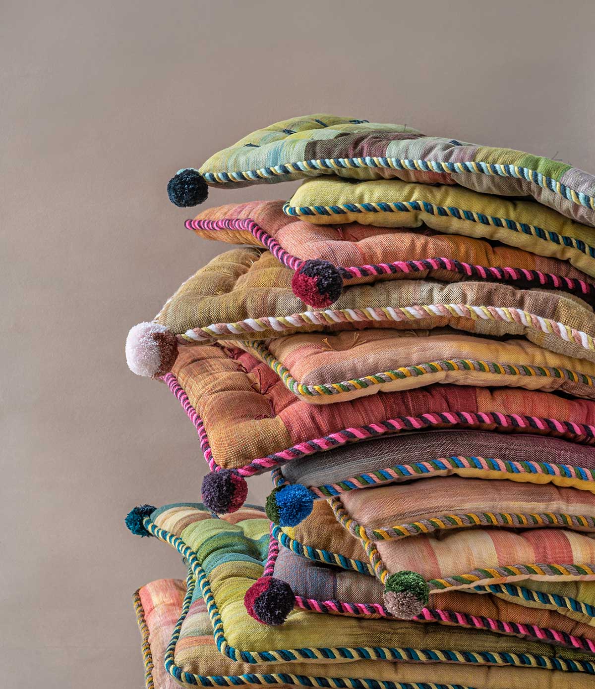 Laneh colorful Silk road seat pads stacked on top of each other