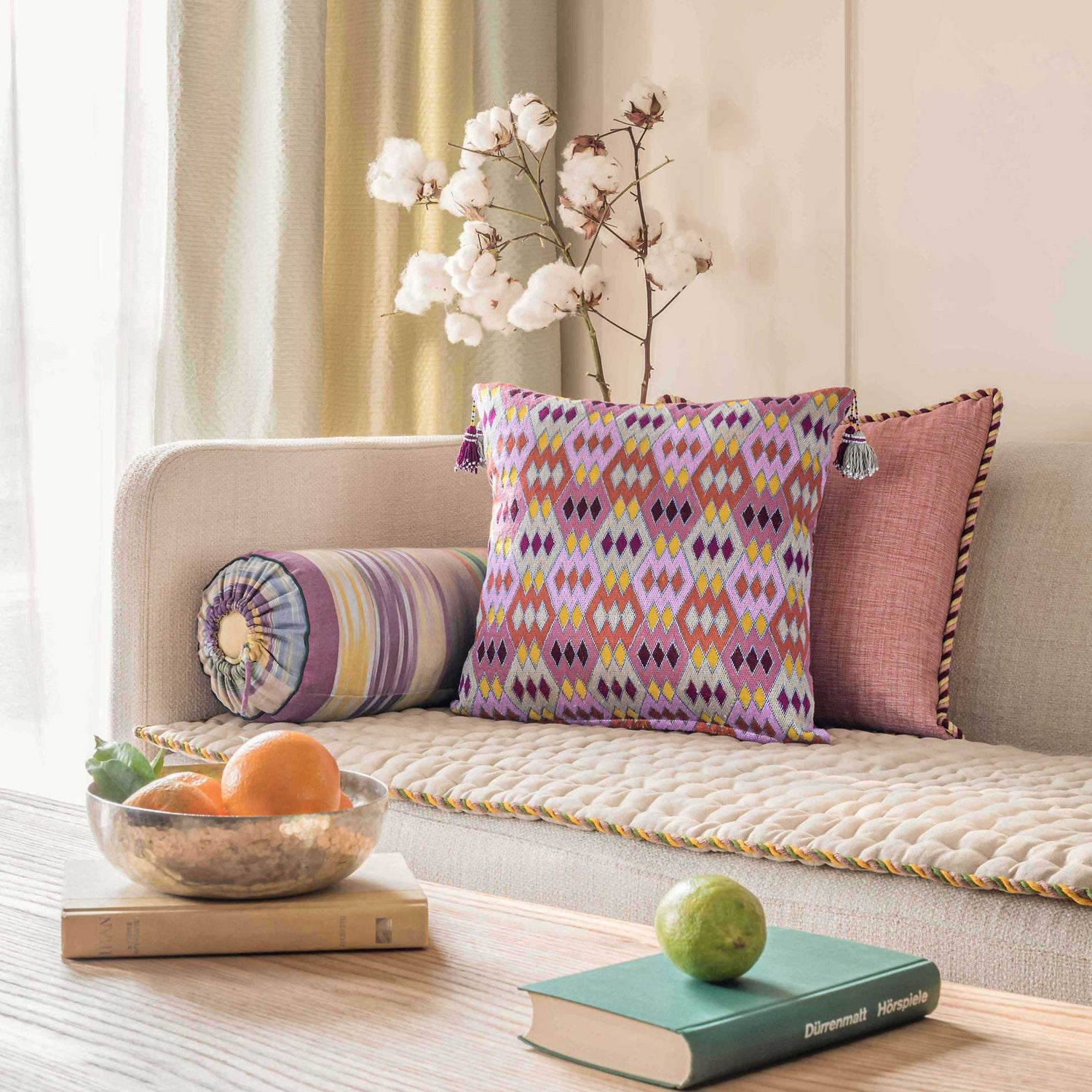 Colorful hand embroidered cushions on a couch