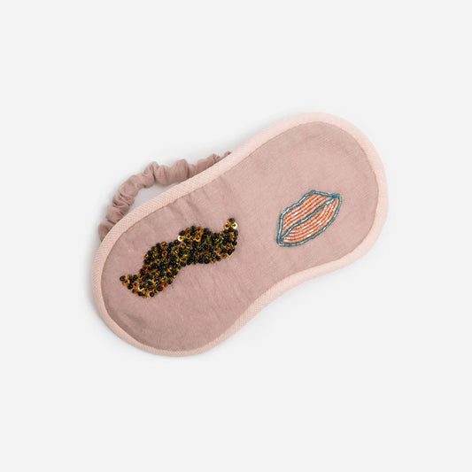 Seashell pink Kereshmeh sleep mask with embroidery of a mustache and a lip