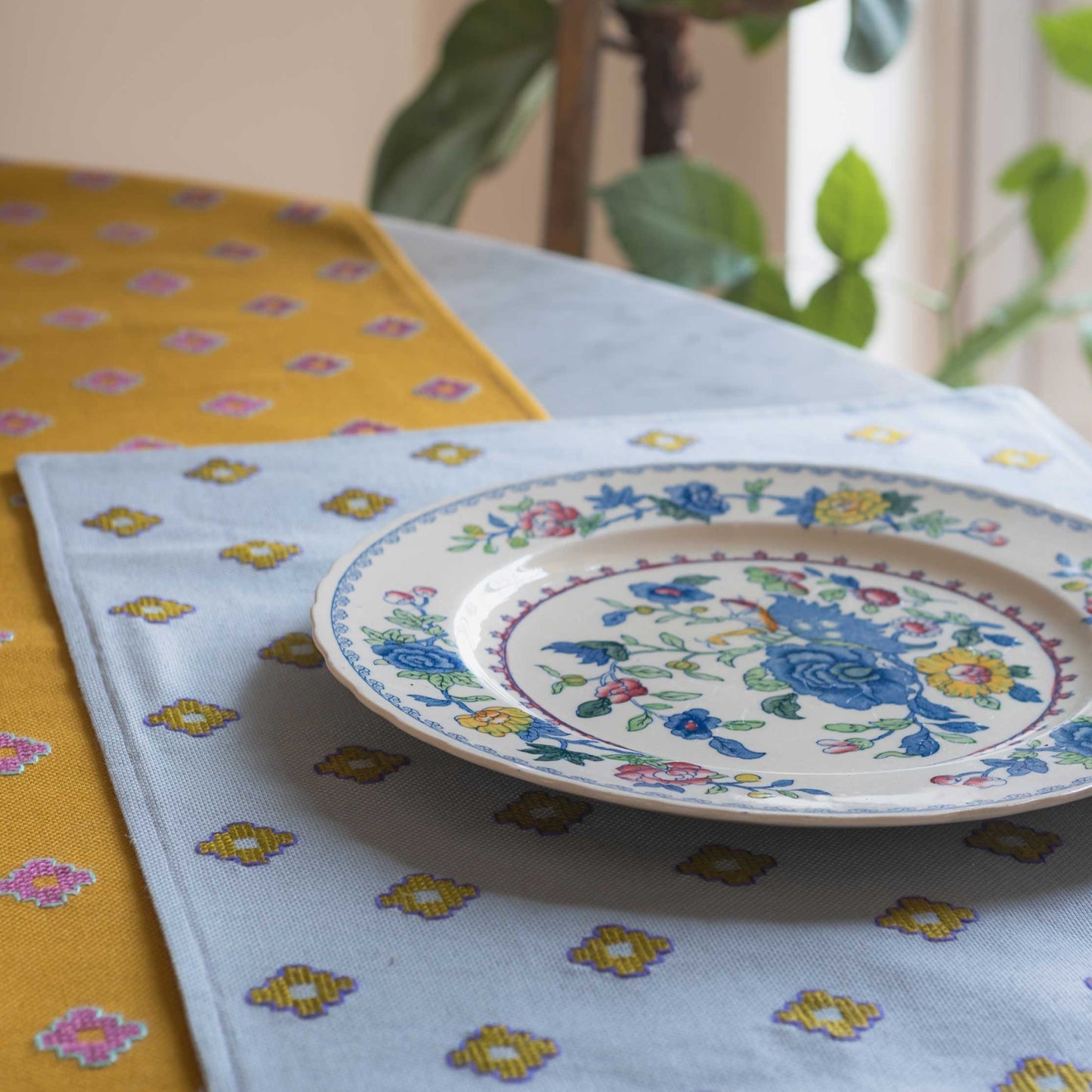 placemat and mustard runner on a table