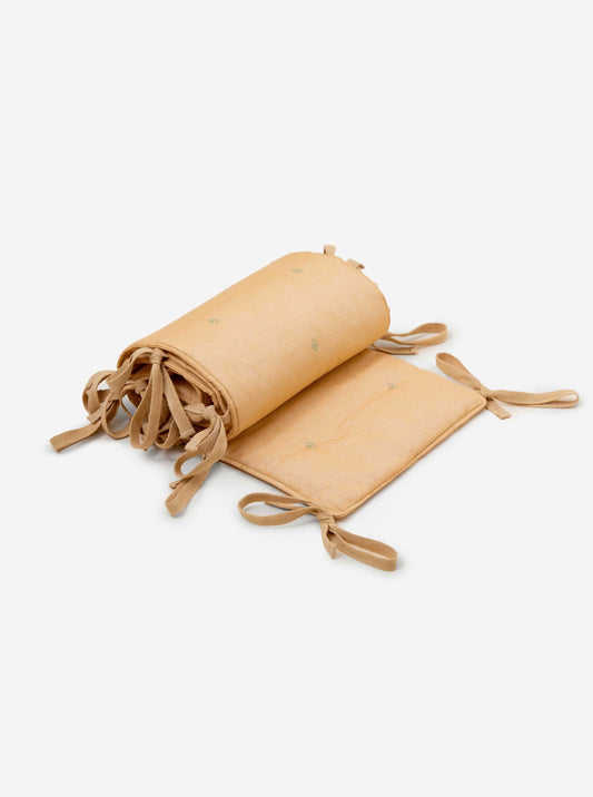 Wheat bandook crib bumper with blue green embroidery