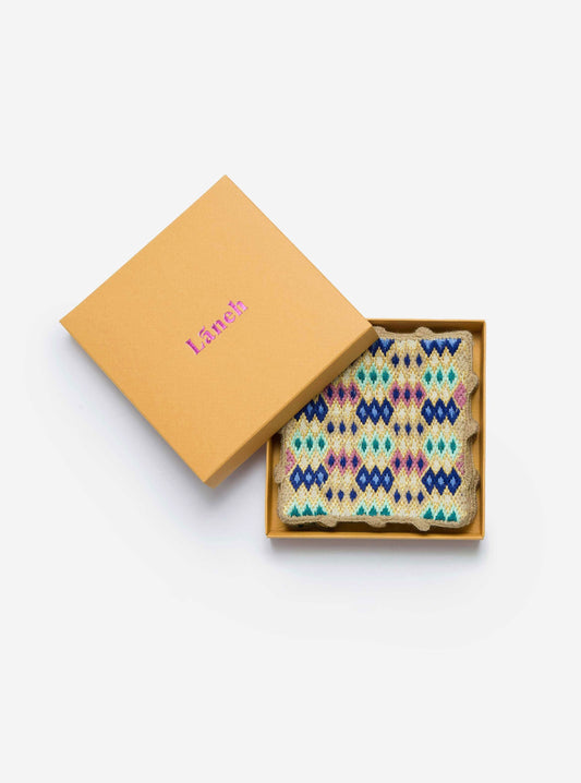 Ivory / Turquoise Bibi coaster set with embroidery inside a yellow Laneh box