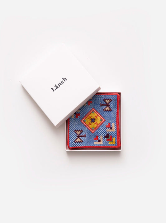 Nile Blue Persian Garden coaster set with Baluchi embroidery inside a white Laneh box