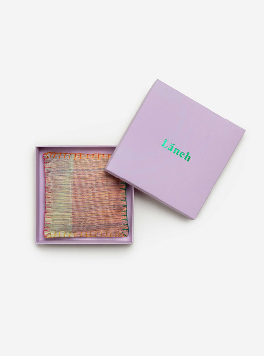 Rainbow colorful blanket stitch around a multi colored lavandin sachet placed inside a lavender Laneh box