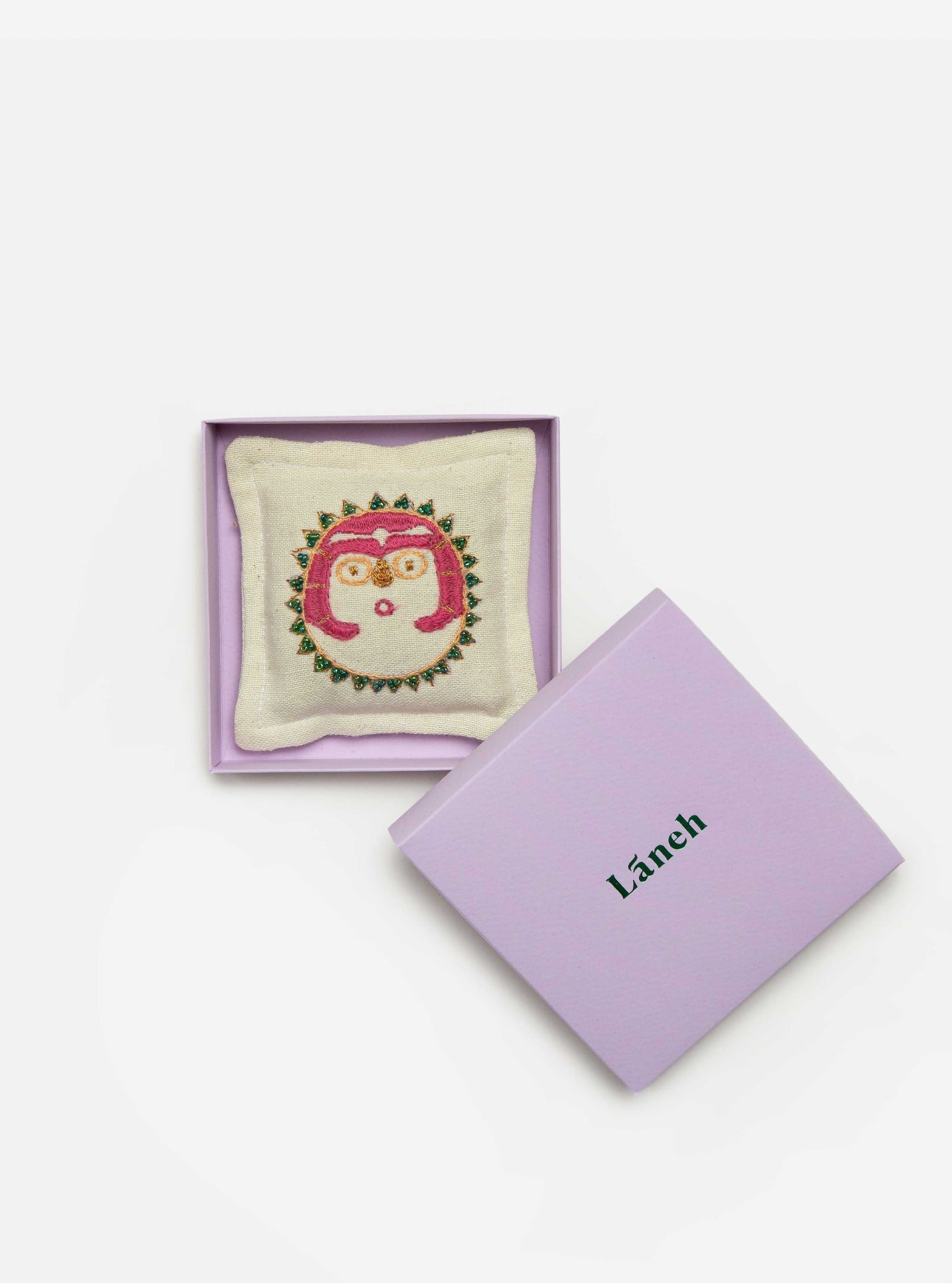 Lemon/ Pink embroidered Sun Lady Lavandin sachet placed inside a lavender Laneh box