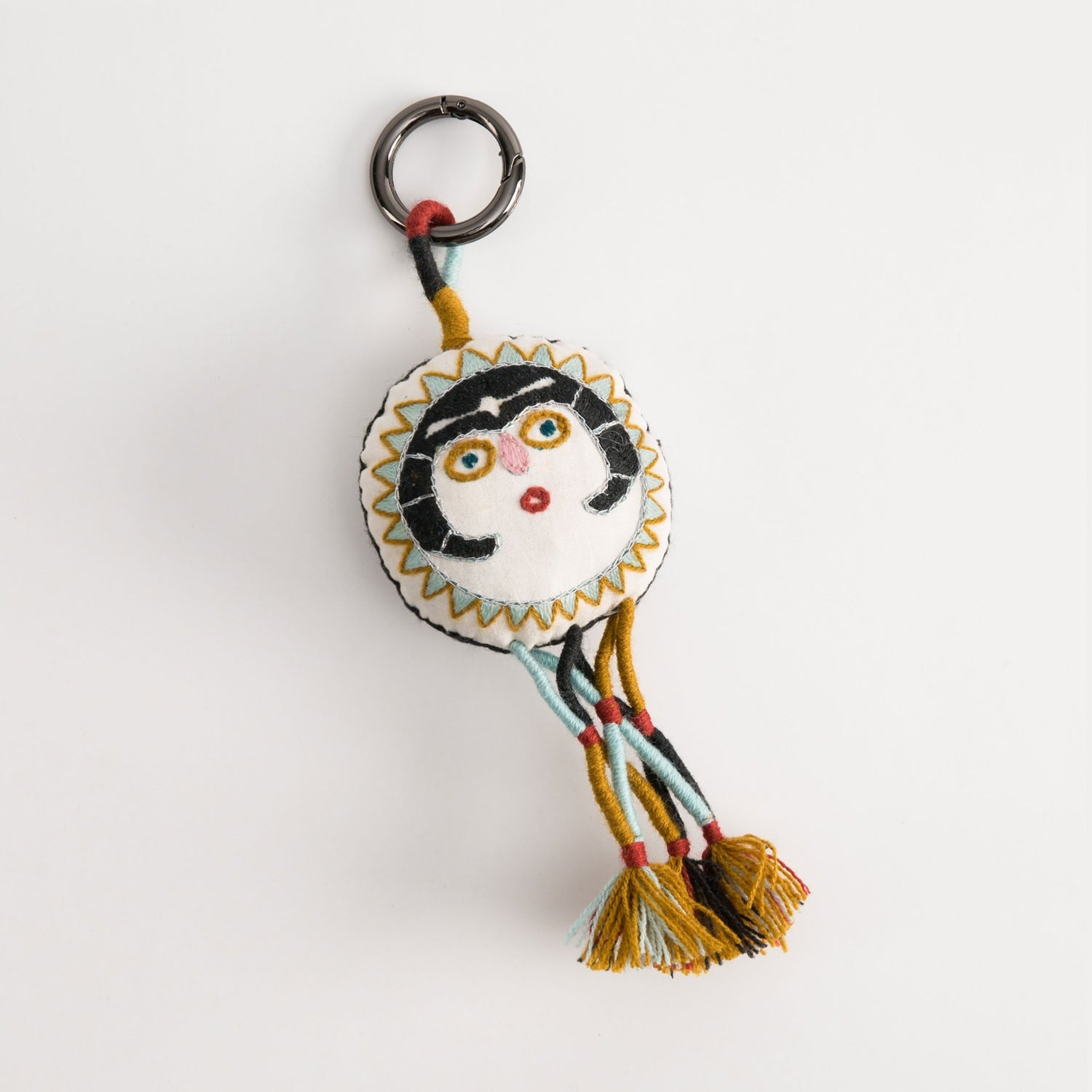 Charcoal Sun Lady charm with embroidery and tassels