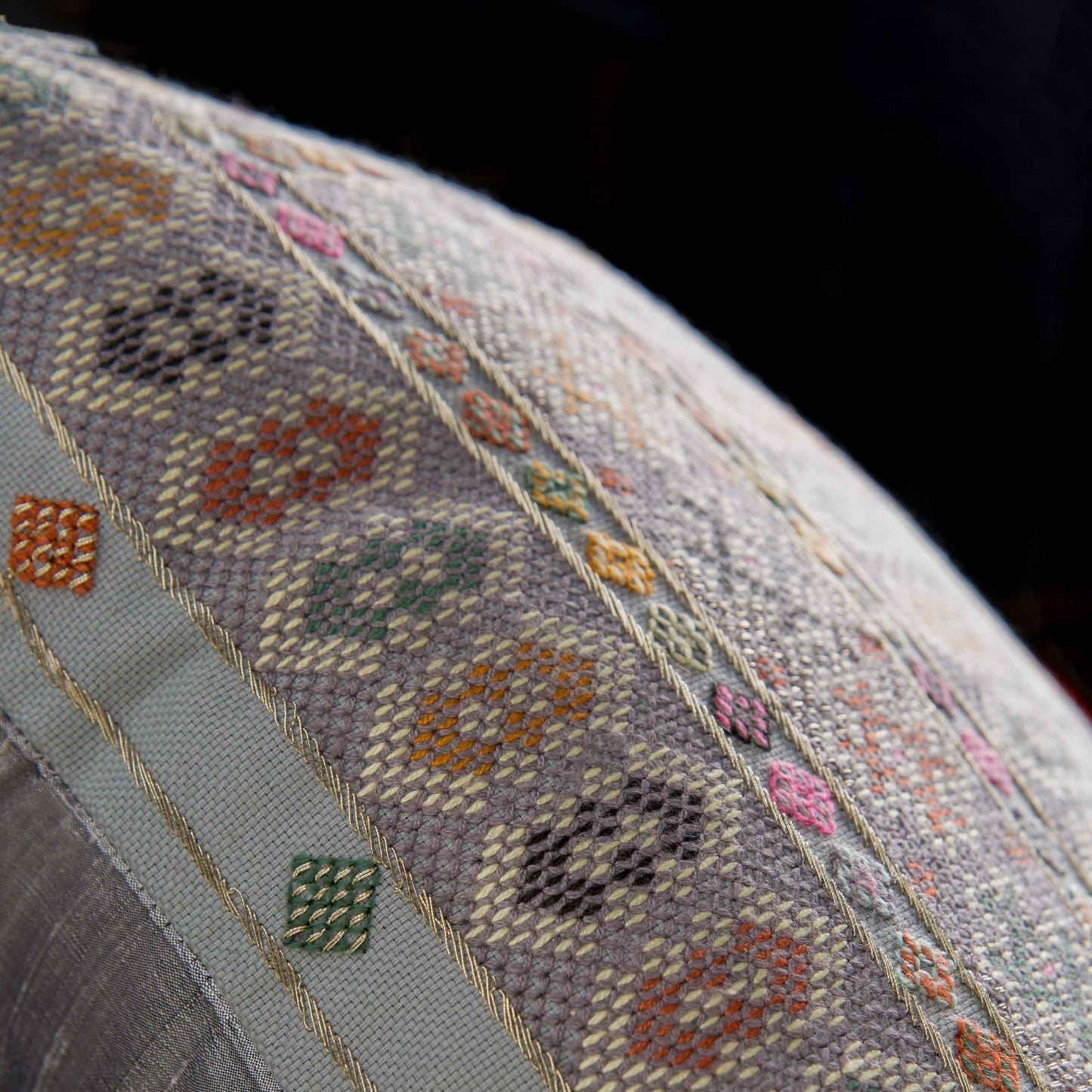 Close up photo of Midnight blue Zee cushion with intense Baluchi embroidery 